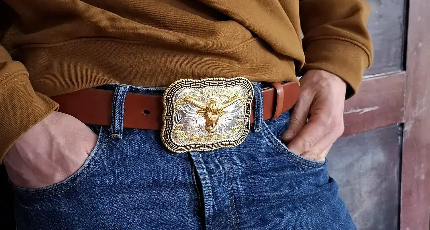 Man With Longhorn Buckle Belt And Blue Jeans Cover